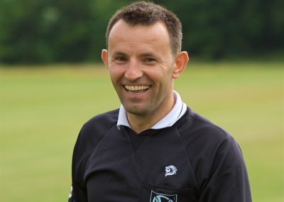 A happy smiling football referee