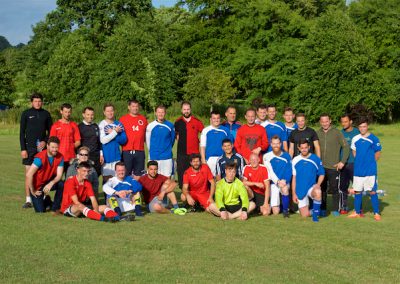 Two footballs team standing united